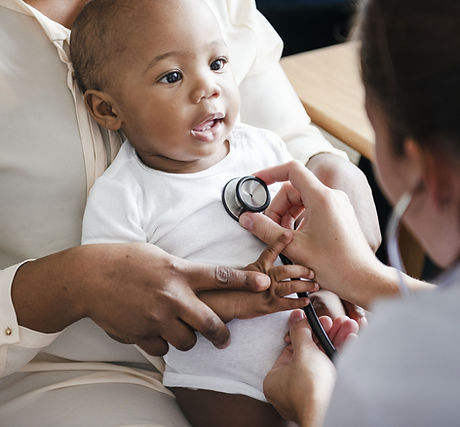 Doctor examining baby with stethoscope